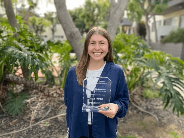 Allie proudly holding her FPFC Award